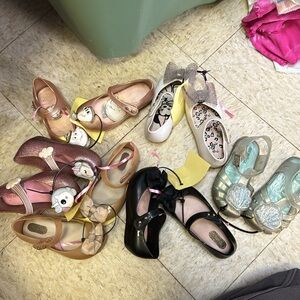 6 pairs of mini melissa shoes
